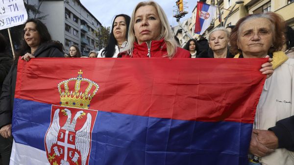 Women hold Serbia's flag as they march in the northern part of Kosovska Mitrovica, Kosovo, Wednesday, Nov. 23, 2022. Serbs in the northern part of Kosovska Mitrovica protested against planned fines by Kosovo authorities for those who refuse to change their Belgrade issued vehicle registration plates and against the cruelty they say are facing daily from the authorities in Pristina. Women hold Serbia's flag as they march in the northern part of Kosovska Mitrovica, Kosovo, Wednesday, Nov. 23, 2022. Serbs in the northern part of Kosovska Mitrovica protested against planned fines by Kosovo authorities for those who refuse to change their Belgrade issued vehicle registration plates and against the cruelty they say are facing daily from the authorities in Pristina. - Sputnik International