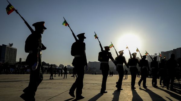 Ethiopian military parade with national flags attached to their rifles at a rally organized by local authorities to show support for the Ethiopian National Defense Force (ENDF), at Meskel square in downtown Addis Ababa, Ethiopia on Nov. 7, 2021. - Sputnik International