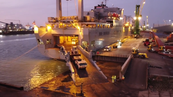 Screenshot of video posted by the Dutch Land Forces picturing arrival of hundreds of US military vehicles at a Dutch port en route to Eastern Europe. Screenshot of video posted by the Dutch Land Forces picturing arrival of hundreds of US military vehicles at a Dutch port en route to Eastern Europe. - Sputnik International