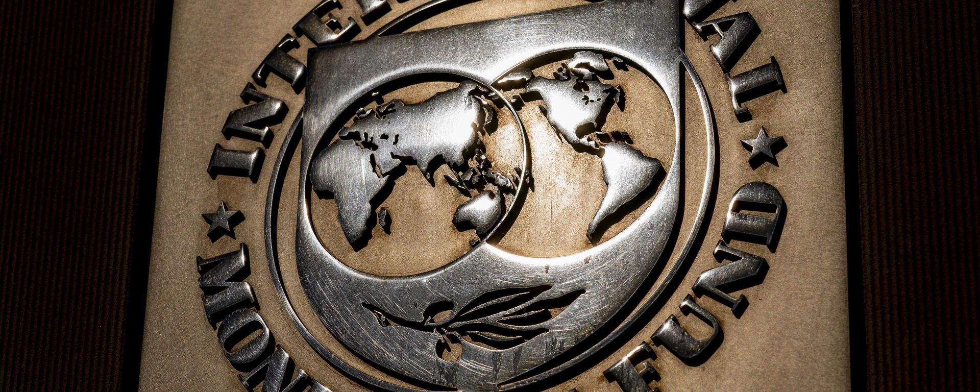 The logo of the International Monetary Fund is visible on their building, Monday, April 5, 2021, in Washington. The International Monetary Fund is downgrading its forecast for the world economy this year, Tuesday, Jan. 25, 2022 - Sputnik International, 1920, 10.10.2023