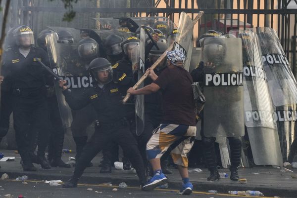 An anti-government protesters charges the police with a club during clashes in Lima, Peru, Thursday, January 19, 2023.  - Sputnik International