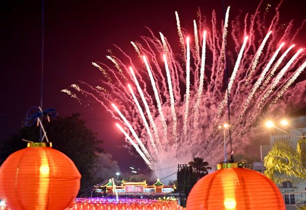 Fireworks explode over lanterns to celebrate the lunar new year in Solo, Central Java on 22 January 2023. - Sputnik International