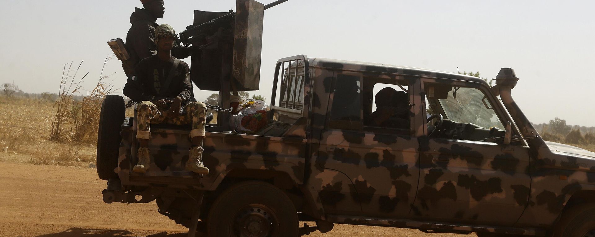 Nigerian soldiers drive past a government secondary school in Kankara, Nigeria, Wednesday, Dec. 16, 2020. - Sputnik International, 1920, 25.01.2023
