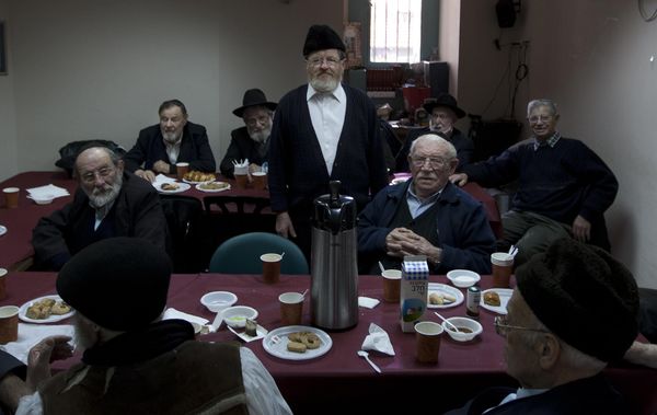 In this January 18, 2012, photo, Ultra Orthodox Jewish holocaust survivors hold a weekly meeting at the Misgav Lakashish seniors' club in the religious neighborhood of Mea Shearim in Jerusalem. It's a huge question for observant Jews: How can one still believe in a merciful God after suffering through the worst genocide in history? Members of Israel's most devout group are unbowed in their faith. (AP Photo/Sebastian Scheiner) - Sputnik International