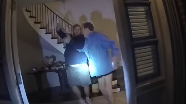 David DePape (L) and Paul Pelosi (R) struggle for control over a hammer in body camera footage from the night of October 28, 2022, that was released by San Francisco Police Department. - Sputnik International