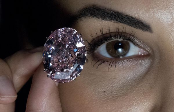 A model poses with a 59.60-carat oval mixed-cut pink diamond, known as 'The Pink Star', during a photocall at Sotheby's in London on 20 March 2017. The diamond, with an estimated value of $60Mln is said to be the largest Internally Flawless Fancy Vivid Pink diamond that the Gemological Institute of America (GIA) has ever graded. A model poses with a 59.60-carat oval mixed-cut pink diamond, known as 'The Pink Star', during a photocall at Sotheby's in London on 20 March 2017. The diamond, with an estimated value of $60Mln is said to be the largest Internally Flawless Fancy Vivid Pink diamond that the Gemological Institute of America (GIA) has ever graded. - Sputnik International
