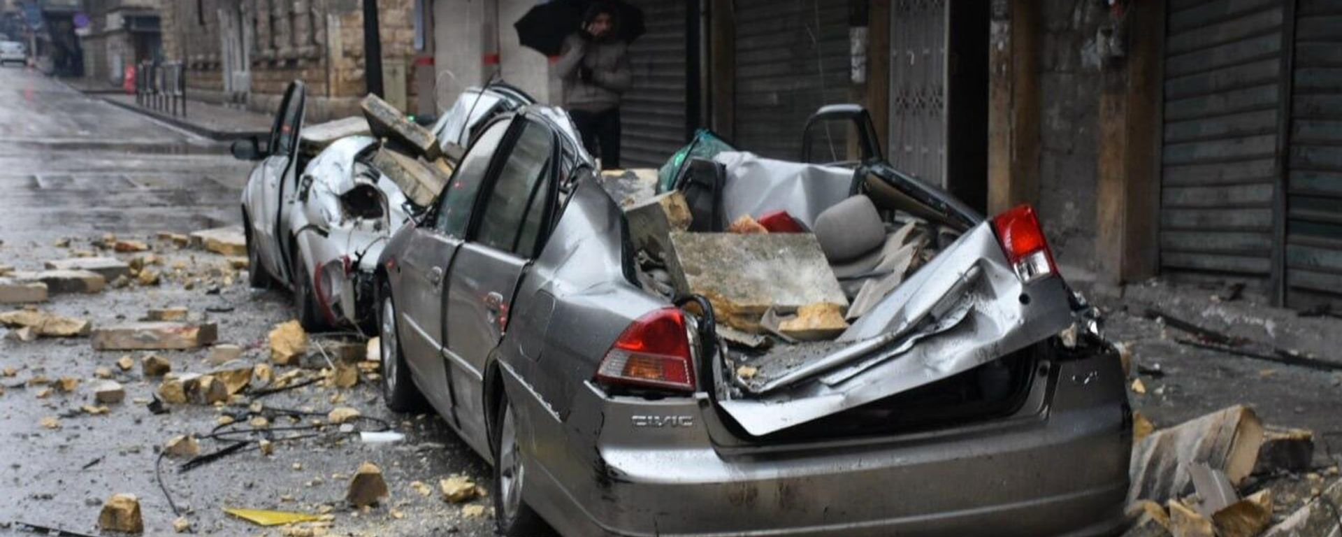 Damaged vehicles after buildings collapsed in Syria's Aleppo following a powerful earthquake. Damaged vehicles after buildings collapsed in Syria's Aleppo following a powerful earthquake. - Sputnik International, 1920, 07.02.2023