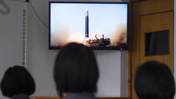 In this photo taken in Pyongyang on March 25, 2022, students of the Pyongyang Jang Chol Gu University of Commerce watch footage of the previous day's launch of the Hwasong-17 missile - Pyongyang's first ICBM test since 2017 - Sputnik International