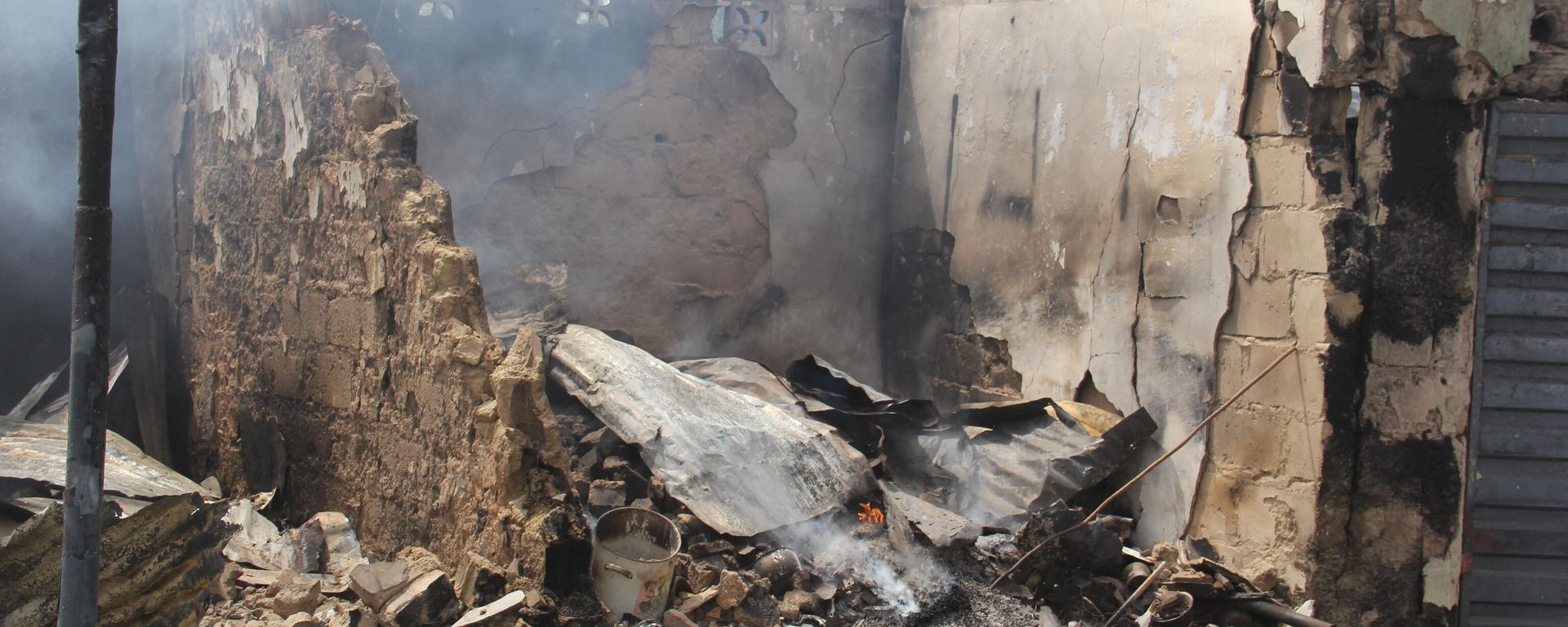 In this photograph taken in Auno on February 10, 2020, shops burnt down by suspected members of the Islamic State West Africa Province (ISWAP) during an attack on February 9, 2020, is seen. - Jihadists killed at least 30 people and abducted women and children in a raid in northeast Nigeria's restive Borno state, a regional government spokesman said on February 10, 2020. In this photograph taken in Auno on February 10, 2020, shops burnt down by suspected members of the Islamic State West Africa Province (ISWAP) during an attack on February 9, 2020, is seen. - Jihadists killed at least 30 people and abducted women and children in a raid in northeast Nigeria's restive Borno state, a regional government spokesman said on February 10, 2020. - Sputnik International, 1920, 10.02.2023