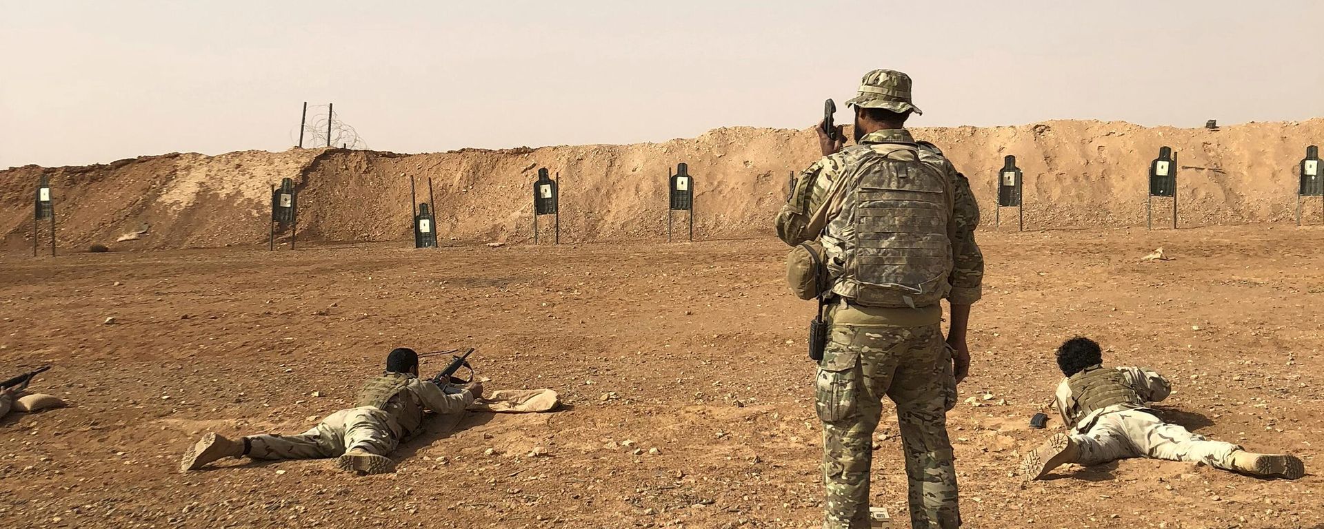 Members of the Maghawir al-Thawra Syrian opposition group receive firearms training from U.S. Army Special Forces soldiers at the al-Tanf military outpost in southern Syria on Monday, Oct. 22, 2018. Members of the Maghawir al-Thawra Syrian opposition group receive firearms training from U.S. Army Special Forces soldiers at the al-Tanf military outpost in southern Syria on Monday, Oct. 22, 2018. - Sputnik International, 1920, 14.02.2023
