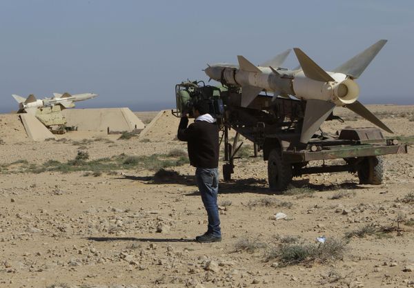 A cameraman records anti-aircraft missiles at an abandoned Libyan military base near Tobruk, Libya, on Wednesday 23 February 2011.   - Sputnik International