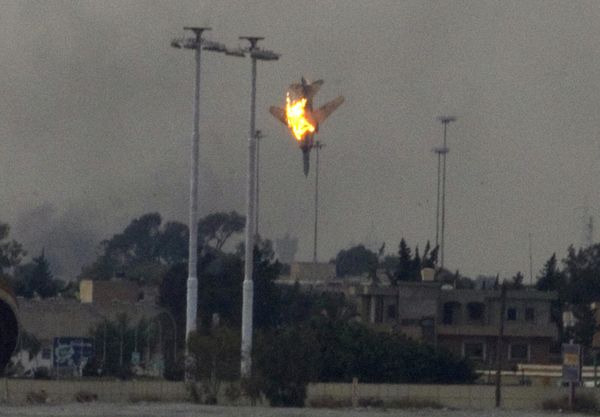 In this picture taken on 19 March 2011, a warplane of Gaddafi's forces is seen being shot down over the outskirts of Benghazi, eastern Libya. - Sputnik International