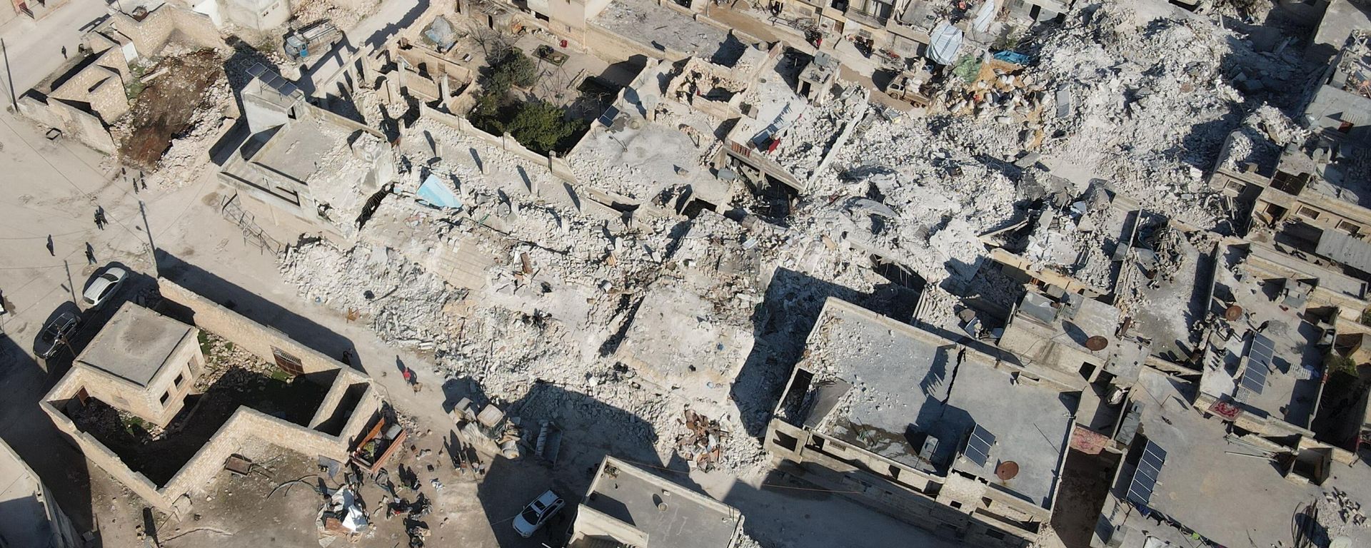 An aerial view shows collapsed buildings following last week's earthquake in Syria's rebel-held village of Atarib, in the northwestern Aleppo province, on February 14, 2023. An aerial view shows collapsed buildings following last week's earthquake in Syria's rebel-held village of Atarib, in the northwestern Aleppo province, on February 14, 2023. - Sputnik International, 1920, 15.02.2023