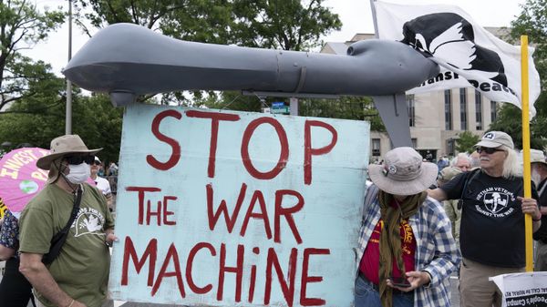 Anti-war demonstrators hold a mock drone as they rally during the Poor People's Campaign, Moral March on Pennsylvania Avenue in Washington, Saturday, June 18, 2022. - Sputnik International