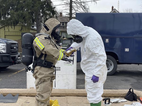 In this photo provided by the Ohio National Guard, ONG 52nd Civil Support Team members prepare to enter an incident area to assess remaining hazards with a lightweight inflatable decontamination system (LIDS) in East Palestine, Ohio. Authorities say air monitoring hasn’t detected dangerous levels of fumes in communities where crews released and burned toxic chemicals from a derailed train. But they also said that Ohio and Pennsylvania residents living close to the wreckage still aren’t being allowed to return to their homes. - Sputnik International