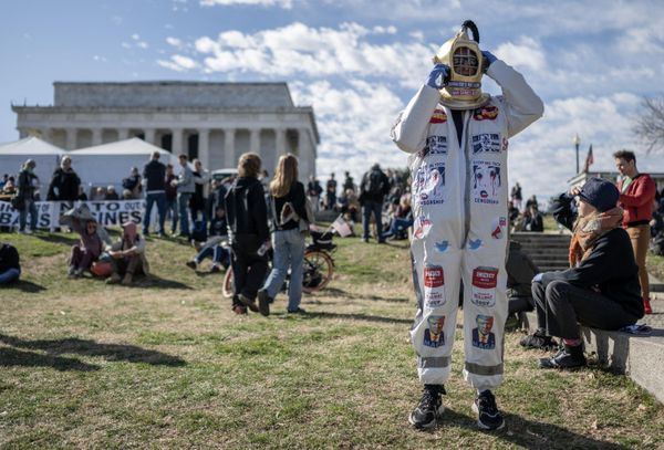 A protester speaks on the phone during an antiwar rally at the Lincoln Memorial in Washington, DC, on February 19, 2023. - Sputnik International