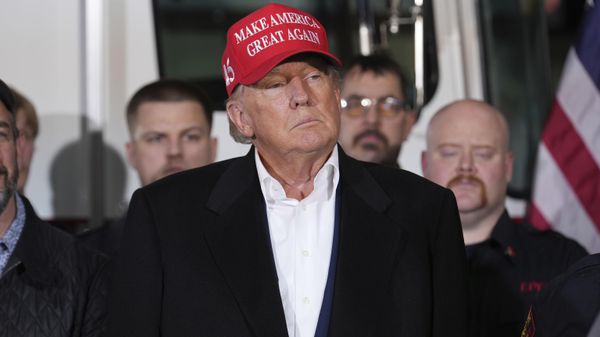 Former President Donald Trump listens to speakers at the East Palestine Fire Department as he visits the area in the aftermath of the Norfolk Southern train derailment Feb. 3 in East Palestine, Ohio, Wednesday, Feb. 22, 2023. - Sputnik International