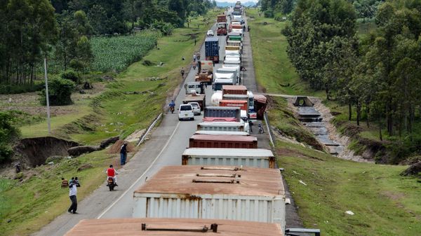 Trucks wait in a line on the road to enter Uganda in Malaba, a city bordering with Uganda, western Kenya, on April 29, 2020 Trucks wait in a line on the road to enter Uganda in Malaba, a city bordering with Uganda, western Kenya, on April 29, 2020 - Sputnik International