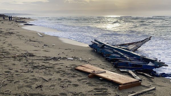 Wreckage of a capsized boat washed ashore at a beach near Cutro, southern Italy, Monday, Feb. 27, 2023. - Sputnik International
