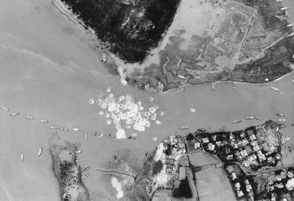 20 mm cannon fire from a U.S. Navy Douglas A-4E Skyhawk from Attack Squadron 55 (VA-55) "Warhorses" splashes in a North Vietnamese river during strikes on barges on July 20, 1966. VA-55 was assigned to Attack Carrier Air Wing 14 (CVW-14) aboard the aircraft carrier USS Ranger (CVA-61) for a deployment to Vietnam from December 10, 1965 to August 25, 1966. - Sputnik International