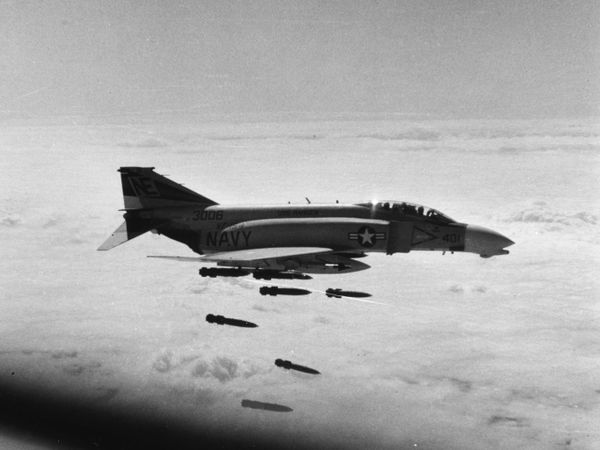 A US Navy McDonnell F-4B-26-MC Phantom II (BuNo 153006) from Fighter Squadron 154 (VF-154) "Black Knights" drops Mark 82 227 kg bombs on an artillery site north of the demilitarized zone in Vietnam, in support of the U.S. 3rd Marine Division, February 1968. The pilot was Lieutenant Junior Grade J. Quaintance, RIO was Lieutenant Junior Grade John H. Kelley. VF-154 was assigned to Attack Carrier Air Wing 2 (CVW-2) aboard the aircraft carrier USS Ranger (CVA-61) for a deployment to Vietnam from November 4, 1967 to May 25, 1968. - Sputnik International