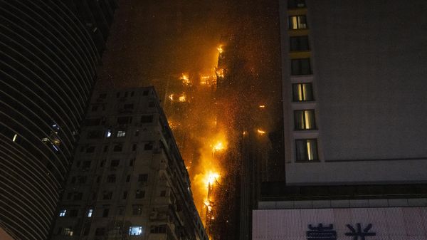 A fire burns at a construction site in Hong Kong, Friday, March 3, 2023. Hong Kong firefighters are battling the blaze that broke out at a construction site in the city's popular shopping district. - Sputnik International