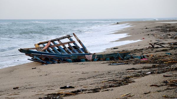 A photograph taken on February 28, 2023 shows parts of a migrants boat, washed on the beach, two day after it sank off Italy's southern Calabria region, in Steccato di Cutro, south of Crotone - Sputnik International