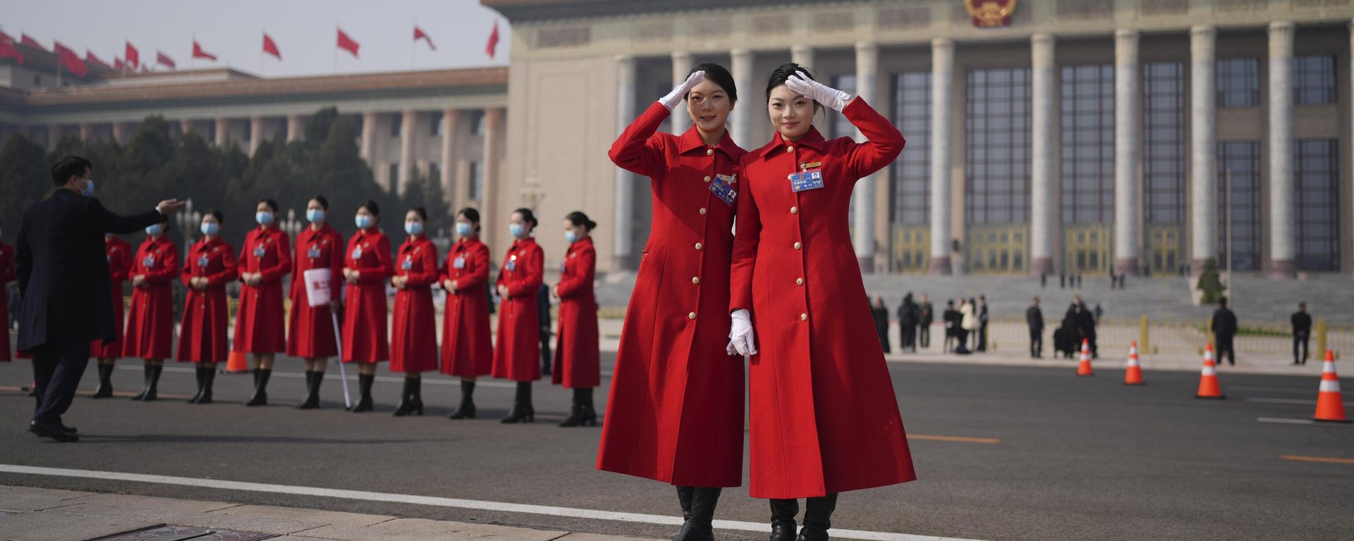 Bus hostesses pose for photos outside the Great Hall of the People Bus hostesses pose for photos outside the Great Hall of the People - Sputnik International, 1920, 05.03.2023