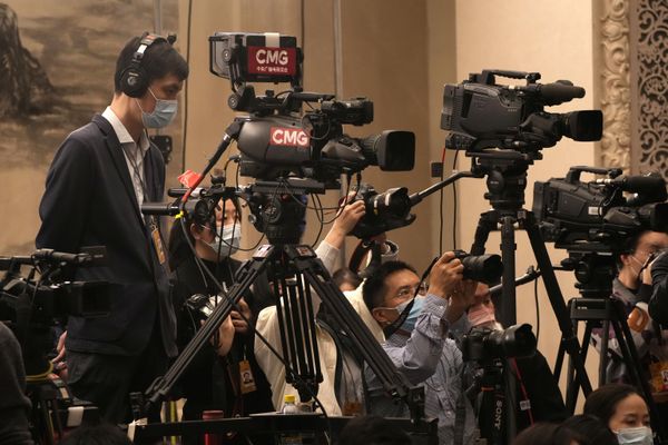 Abouve: Journalists atted a press conference on the eve of the opening session of the annual meeting of China's National People's Congress (NPC) at the Great Hall of the People in Beijing. - Sputnik International