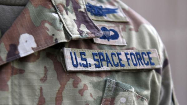 In this photo released by the US Air Force, Capt. Ryan Vickers stands for a photo to display his new service tapes after taking his oath of office to transfer from the US Air Force to the US Space Force at Al-Udeid Air Base, Qatar, Tuesday, Sept. 1, 2020. - Sputnik International