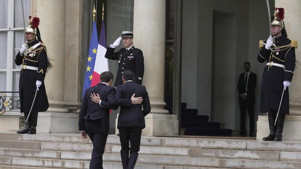 Britain's Prime Minister Rishi Sunak, center right, and French President Emmanuel Macron walk during their meeting at the Elysee Palace in Paris - Sputnik International