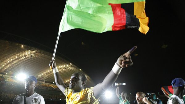 Zambia's goalkeeper Kennedy Mweene carries a Zambia flag as he celebrates his team winning the African Cup of Nations, after beating Ivory Coast in the tournament final soccer match at Stade de l'Amitie in Libreville, Gabon Sunday, Feb. 12, 2012. - Sputnik International
