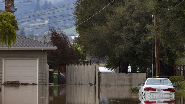 A car is surrounded by floodwaters in Watsonville, Calif., Friday, March 10, 2023. More than 9,000 California residents were under evacuation orders Friday as a new atmospheric river brought heavy rain, thunderstorms and strong winds, swelling rivers and creeks and flooding several major highways during the morning commute. - Sputnik International