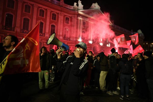 A protester uses a megaphone in the square in front of the Capitole de Toulouse during a demonstration after the French government pushed pension reform through parliament without a vote, invoking Article 49.3 of the constitution, in Toulouse, south-western France, on 16 March 2023. - Sputnik International