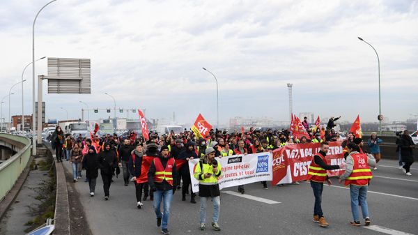 CGT unionists march with banners on March 17, 2023, a day after the French government pushed a pensions reform through parliament without a vote. - Sputnik International