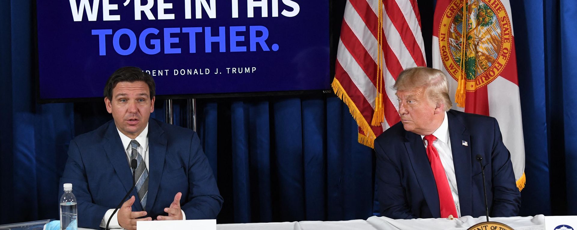 US President Donald Trump (R) and Florida's governor Ron DeSantis hold a COVID-19 and storm preparedness roundtable in Belleair, Florida. File photo. - Sputnik International, 1920, 20.03.2023