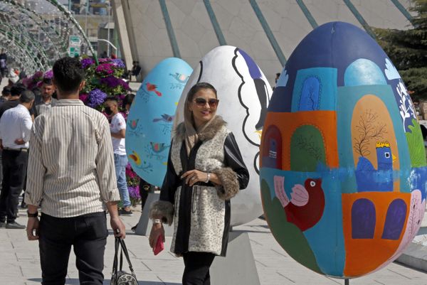 People gather around colourful eggs in Tehran's Azadi Square as they celebrate Nowruz.  - Sputnik International