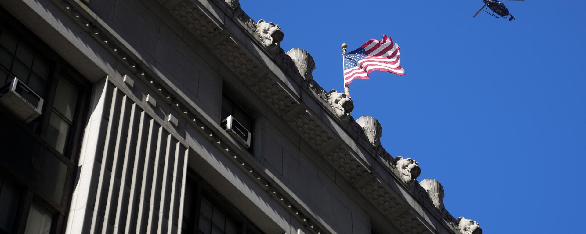 A news helicopter hovers over lower Manhattan in New York, Monday, March 20, 2023. A lawyer allied with Donald Trump is expected to testify before a New York grand jury. Such testimony could give the Republican former president an indirect opportunity to make a case he shouldn’t face criminal charges over hush money paid during his 2016 campaign. - Sputnik International, 1920, 21.03.2023