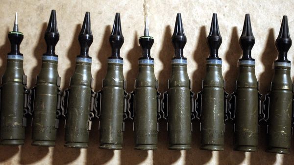 A row of US Army  25mm rounds of depleted uranium ammunition, 11 February 2004, at the base of Charlie Company, 1-22 Battalion, 4th Infantry Division, in Tikrit, 180 km (110 miles) north of Baghdad - Sputnik International
