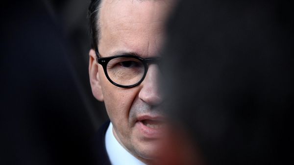 Poland's Prime Minister Mateusz Morawiecki talks to the press at the end of a EU Summit, at the EU headquarters in Brussels, on March 24, 2023.  - Sputnik International