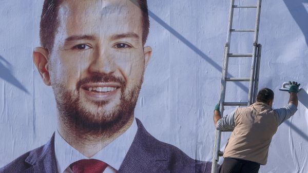 A worker sets a pre-election billboard showing Jakov Milatovic, a newcomer supported by the shaky governing coalition with links to neighboring Serbia, in Podgorica, Montenegro, Thursday, March 30, 2023. Voters in small Montenegro go to the polls this weekend to choose their next president in a runoff race between Milo Djukanovic and Jakov Milatovic. - Sputnik International