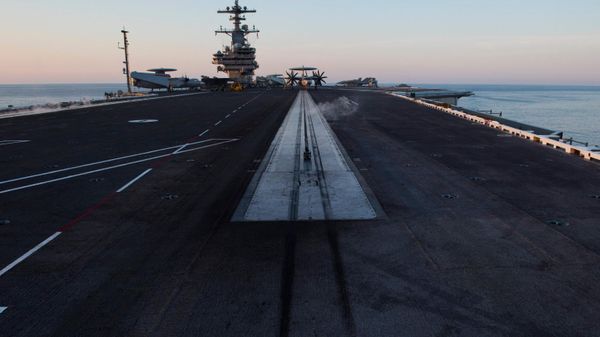 The end of the catapult runway is seen early in the morning on the deck of the the USS George H.W. Bush aircraft carrier during a deployment. File photo. - Sputnik International