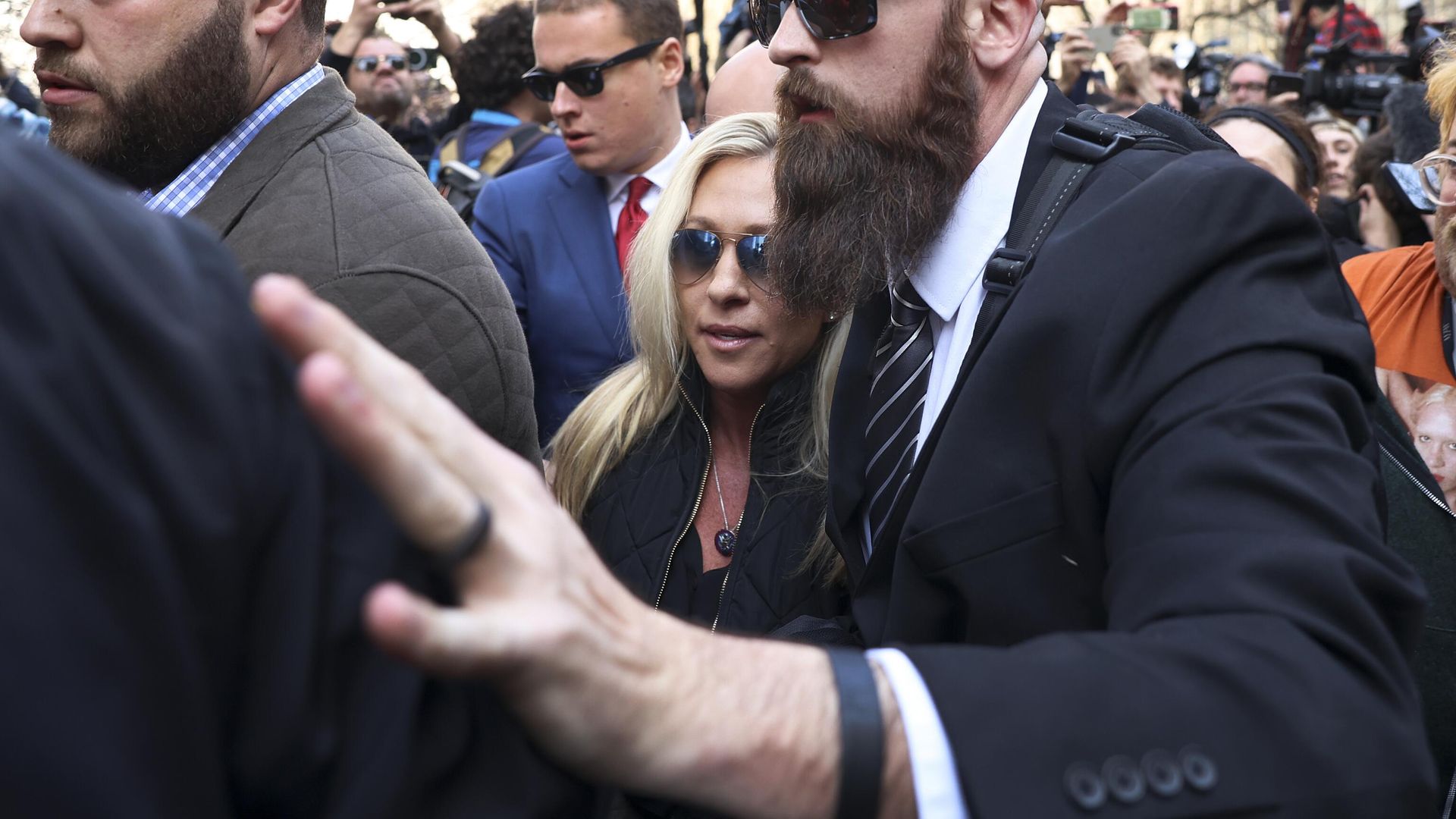 Rep. Marjorie Taylor Greene, R-Ga., is escorted through a crowd while attending a protest held in Collect Pond Park across the street from the Manhattan District Attorney's office in New York on Tuesday, April 4, 2023. Former President Donald Trump, who faces multiple election-related investigations, will surrender and be arraigned at Manhattan court Tuesday on criminal charges stemming from 2016 hush money payments.  - Sputnik International, 1920, 05.04.2023