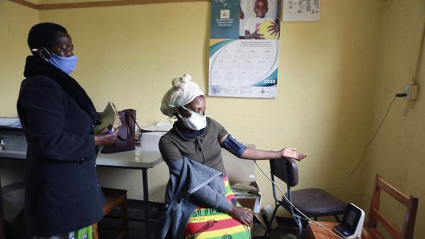 A woman gets her blood pressure checked at a rural clinic on the outskirts of Harare, Thursday, Aug. 20, 2020. - Sputnik International