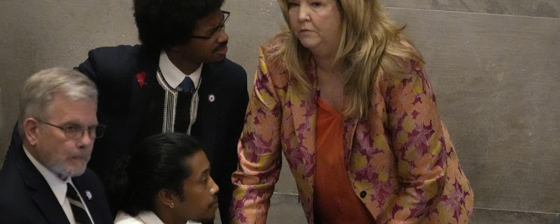Rep. Justin Jones, D-Nashville, center, Rep. Justin Pearson, D-Memphis, back left and Rep. Gloria Johnson, D-Knoxville, huddle on the floor of the House chamber Thursday, April 6, 2023, in Nashville, Tenn. Tennessee Republicans are seeking to oust the three House Democrats for their role in a demonstration calling for gun control following the Nashville school shooting.  - Sputnik International, 1920, 07.04.2023