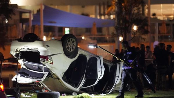 Israeli police and emergency services work around a car involved in an attack in Tel Aviv, Israel, Friday, April 7, 2023. Israeli police said a car rammed into a group of people near a popular seaside park before flipping over. Police said they shot the driver of the car. Israel's rescue service described the incident as a shooting attack. - Sputnik International