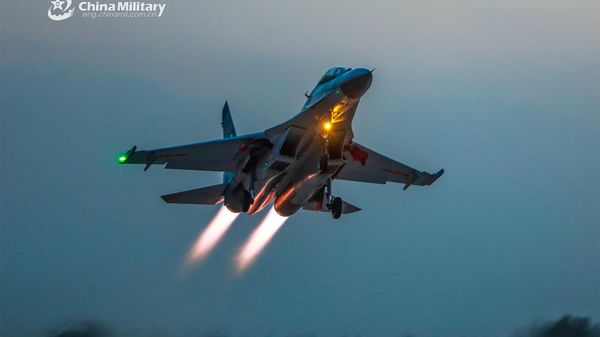 A fighter jet attached to an aviation regiment of the PLA Air Force takes off for a recent round-the-clock flight training exercise. (eng.chinamil.com.cn/Photo by Yuan Hua) - Sputnik International