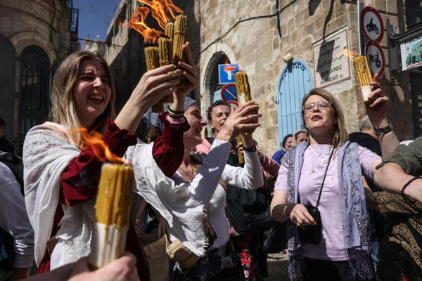 Christian worshippers carry candles lit with the Holy Fire. - Sputnik International