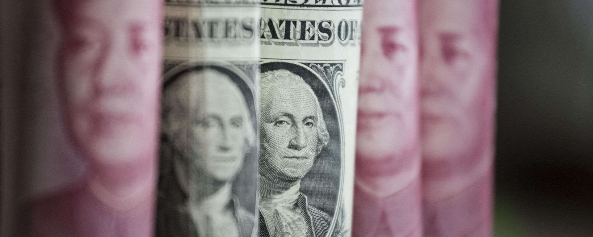 This photo illustration taken on January 6, 2017 shows Chinese 100 yuan notes and one US dollar notes in Beijing This photo illustration taken on January 6, 2017 shows Chinese 100 yuan notes and one US dollar notes in Beijing - Sputnik International, 1920, 03.05.2023