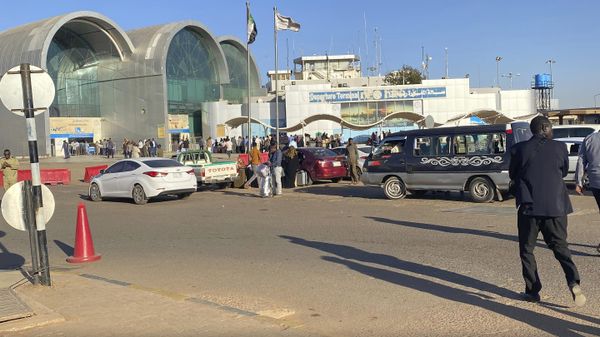 People wait outside Khartoum International Airport, in Khartoum, Sudan, Tuesday, Jan. 14, 2020. A Sudanese official said Tuesday, that security forces have contained an armed protest from within the security apparatus, amid reports of unrest. Earlier Tuesday, workers had told travelers at the airport in Sudan's capital that the facility will be closed temporarily.  - Sputnik International